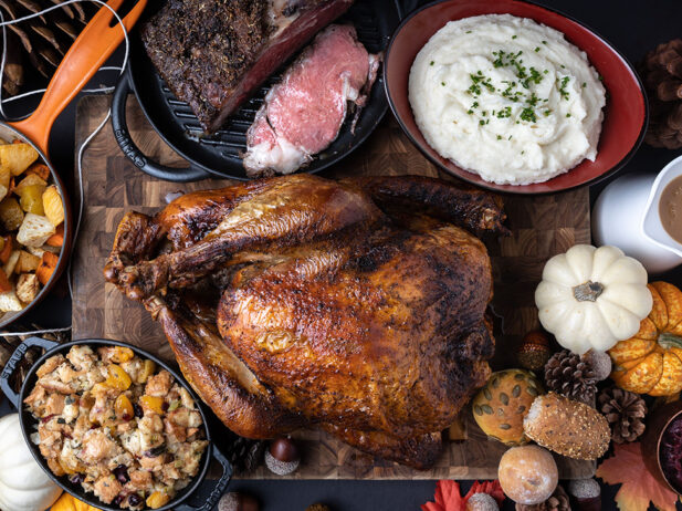 Dinner with Turkey and potatoes and stuffing with gourds for decoration