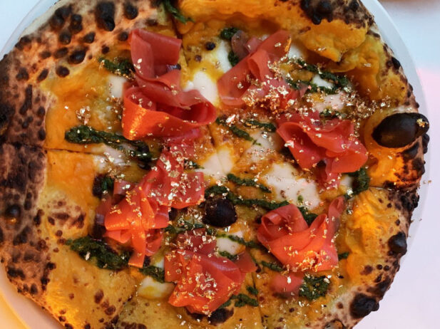 24 carrot gold pizza from gastronomy gastown: gold leaf, carrot purée, pickled carrot, fior di latte, basil pesto