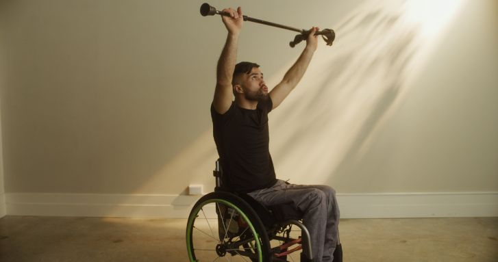 man in wheelchair working out