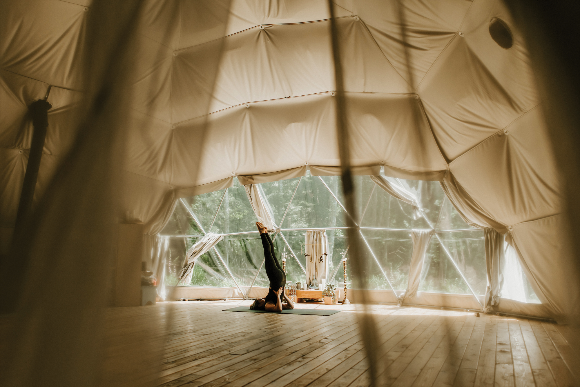 woman doing yoga pose in a dome