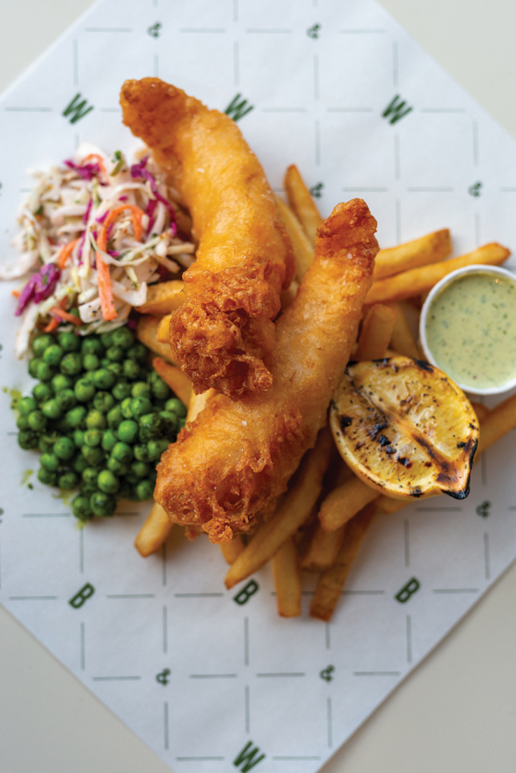 fish and chips on a wax paper