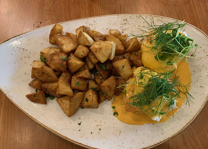 Eggs benedict and home fries
