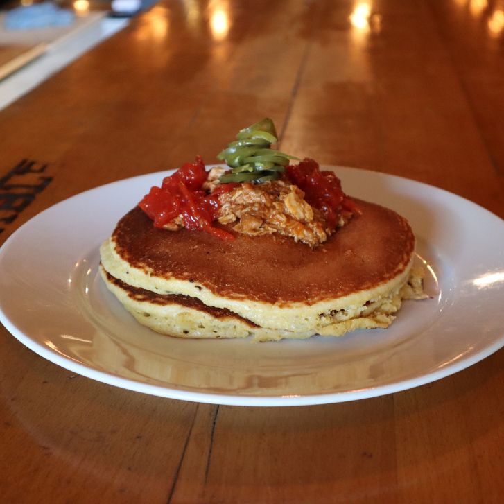 Flapjacks topped with barbecue pulled pork