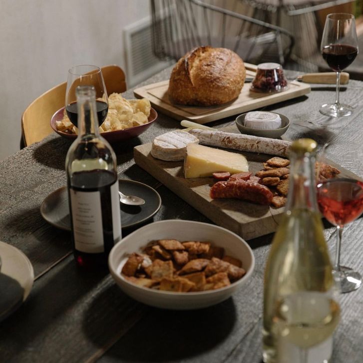 Two bottles of wine with charcuterie