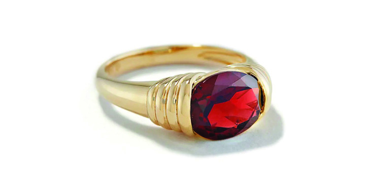 gold ring with large red stone