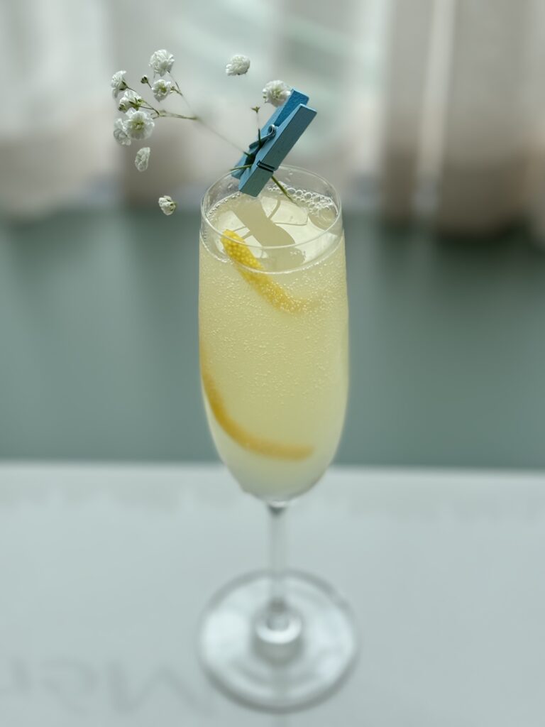 a pretty yellow cocktail in a glass