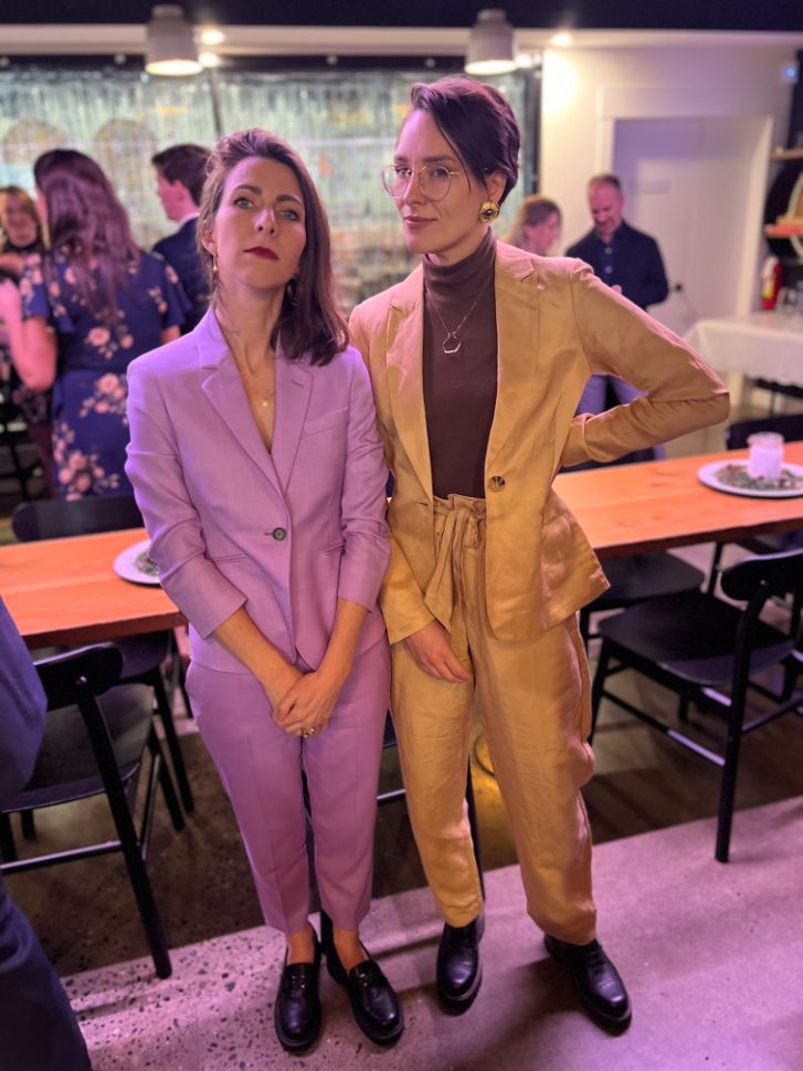 stacey shows off her purple suit at a party
