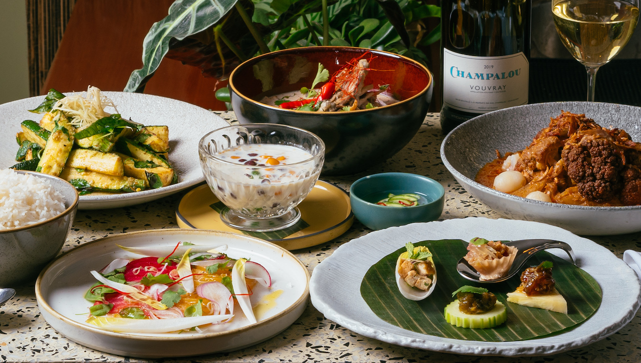 Table full of Thai dishes.