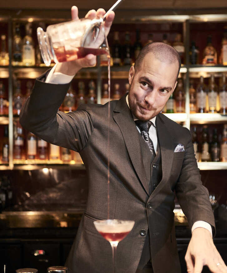 Batender pouring a cocktail