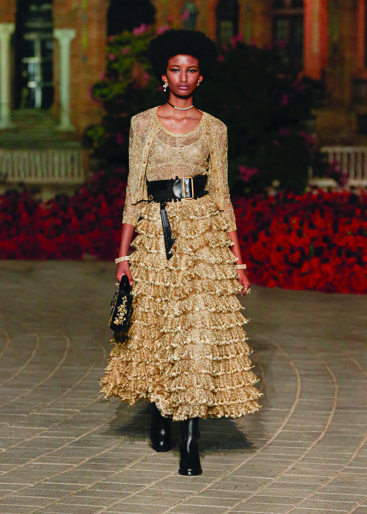 lace twin set and skirt crafted in gold thread and celebrating Andalusian culture