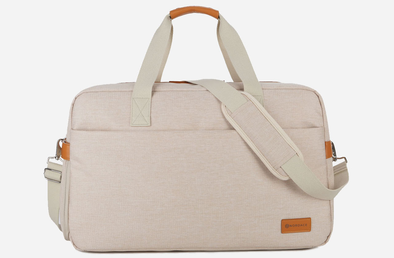 Beige nordace weekender bag with beige faux leather detailing on handles.