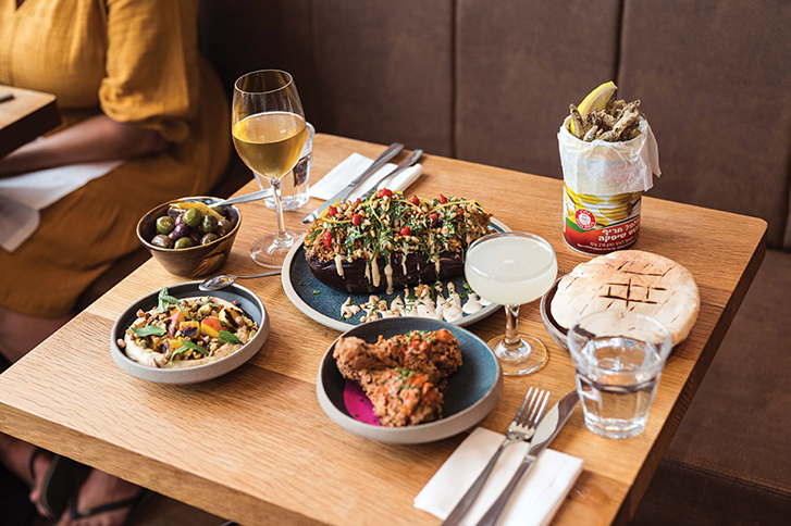a table covered in middle eastern food