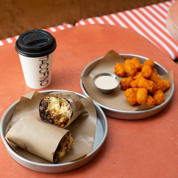 A burrito, coffee and tater tots