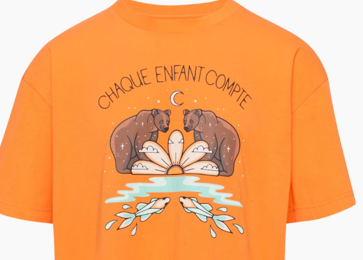 Orange t-shirt with design. 