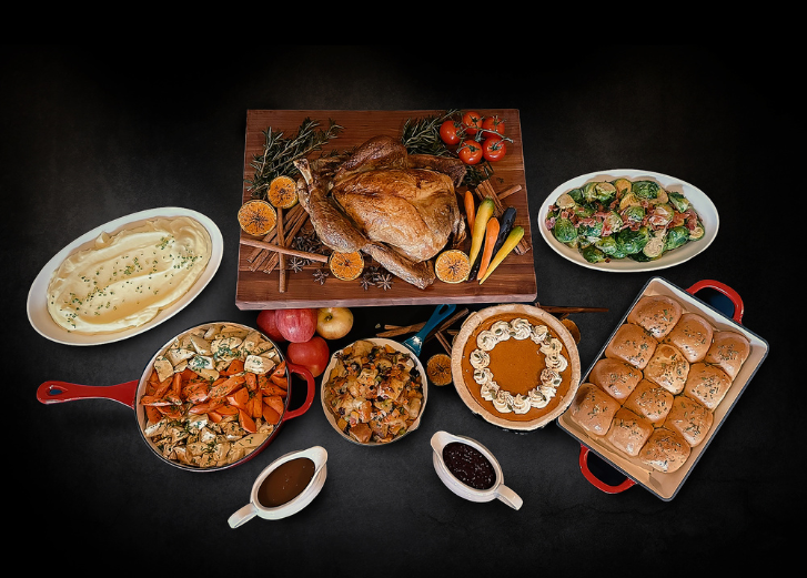 Turkey Dinner spread on black backdrop. 