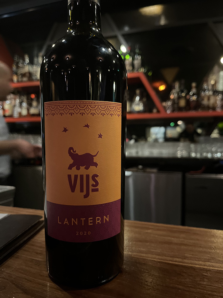Vij's x Kismet Estate Winery Lantern Wine sitting on a bar.