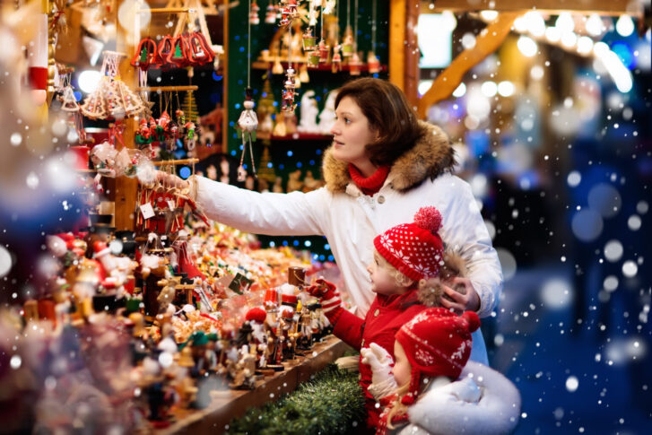 Mother and daughter buying souvenirs on Christmas